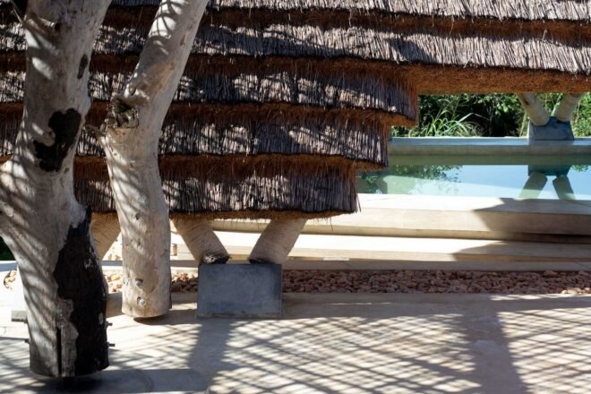 a walkway leading to a swimming pool