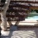 a walkway leading to a swimming pool