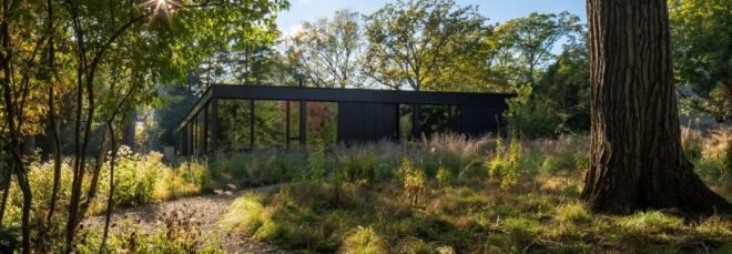 one-story home clad in jet black cladding