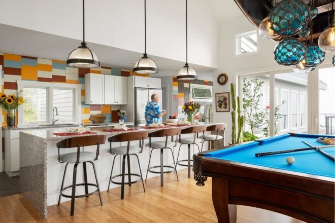 kitchen with long island and colorful tiled backsplash
