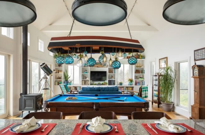 a large room with billiards table in the middle