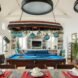 a large room with billiards table in the middle
