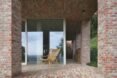 sliding glass door leading into brick home