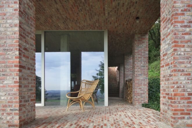 sliding glass door leading into brick home
