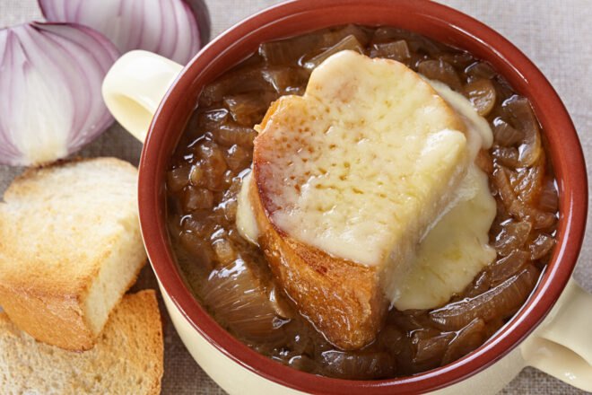 vegan French onion soup topped with toast and vegan cheese