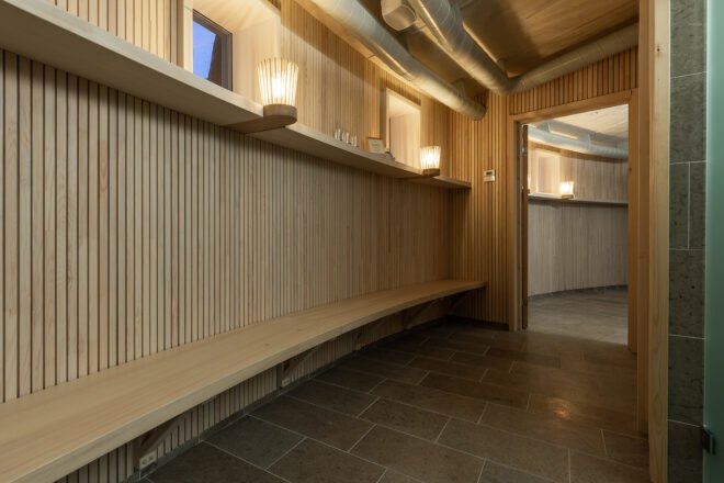 a circular sauna space with bench seating