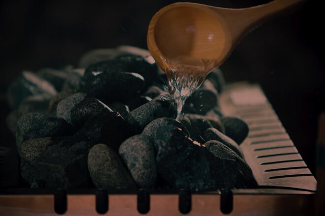closeup shot of bucket of spa rocks