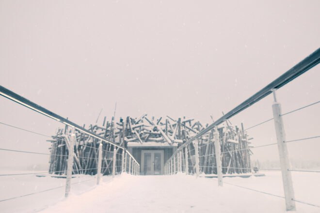 walkway leading up to nest-like building