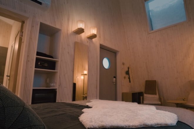 a bedroom suite with windows