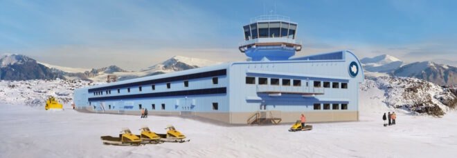 long blue building in snowy Antarctic landscape