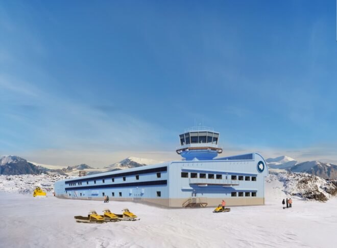 long blue building in snowy Antarctic landscape