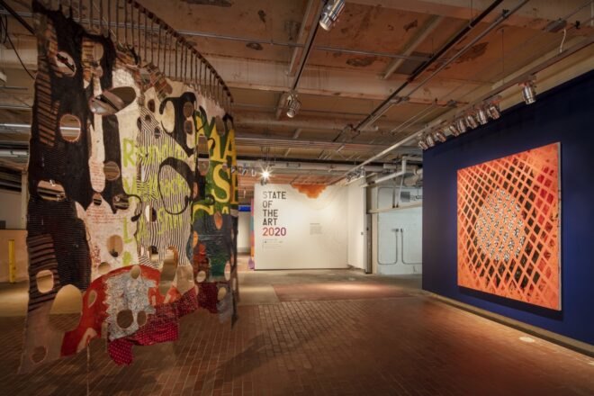 multicolored and patterned art hanging from a ceiling