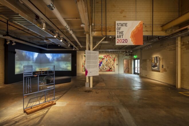 industrial room with sign that reads "State of the Art 2020"
