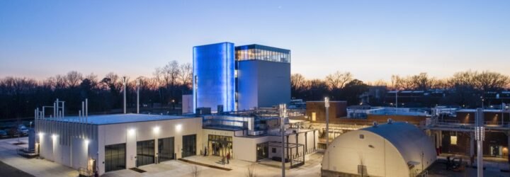 large white and blue building at dusk