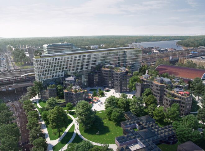 overhead shot of the office complex, showing surrounding greenery and window-covered facades
