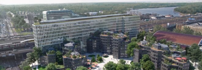 overhead shot of the office complex, showing surrounding greenery and window-covered facades