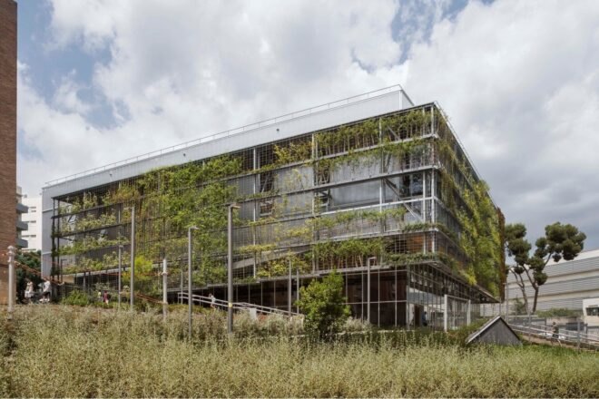 large building covered in greenery