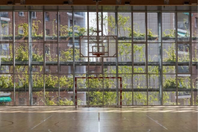 wall with glass panels and hanging greenery