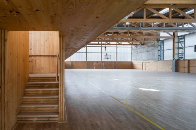 large indoor sports room with stairwell