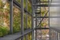 metal exterior of building with hanging greenery