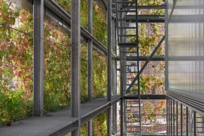 metal exterior of building with hanging greenery