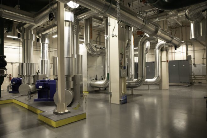 interior of a factory-like area, with metal tubing