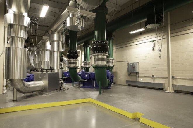 interior of a factory-like area, with yellow lining on the ground