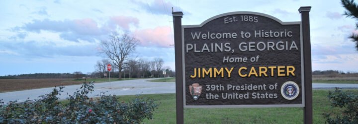 brown sign that reads, 