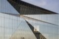 close-up of all-glass building with angular roof