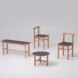 two chairs, a bench and a side table all made from wood and linoleum