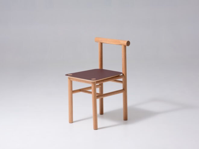 oak wood chair with a red seat