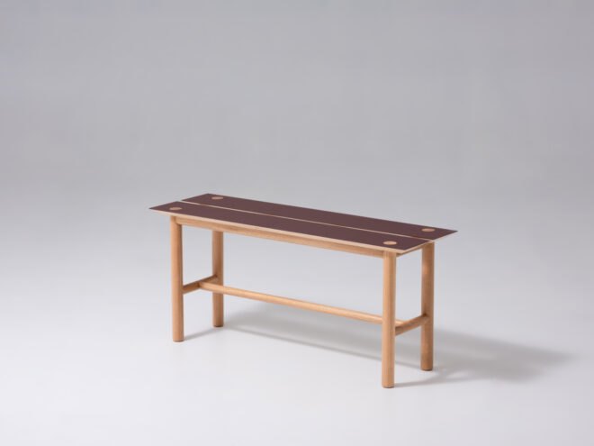 oak wood bench with a red seat