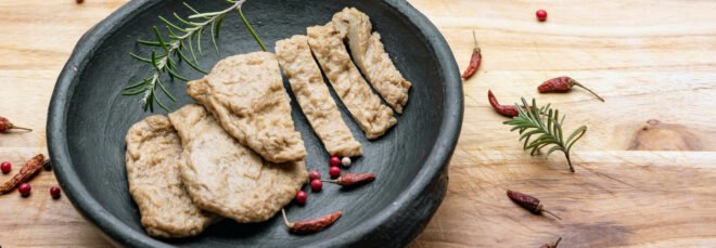 fake meat that looks like chicken in a slate gray bowl