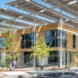 light wood and glass building with overextended roof
