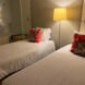 two white twin beds in a hotel room at Kripalu Center for Yoga & Health