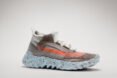 gray laceless sneaker with orange stripe