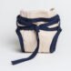 tan reusable diaper with blue ties around the waist