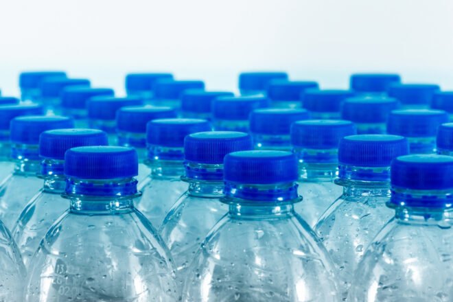 blue plastic bottles of water