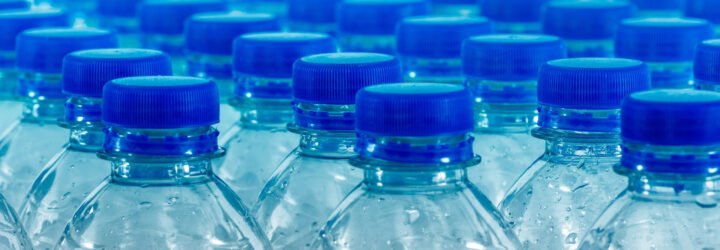 blue plastic bottles of water