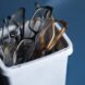 white tub filled with old eye glasses