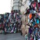 stacked of bounded recycled clothes at a landfill