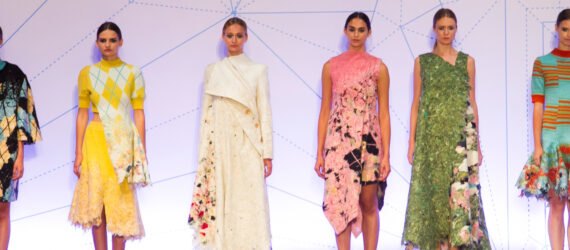 runway models wearing dresses made from recycled fabric