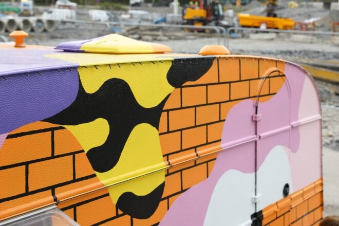 a painted on brick facade with globs of color