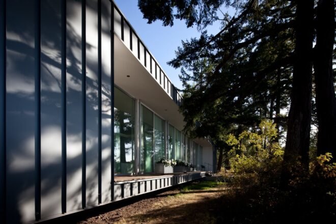 a home clad in large glass panels