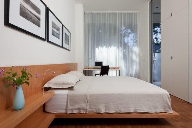 a queen-sized bed with white linens
