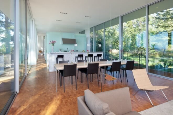 a large living space with seating and an open kitchen