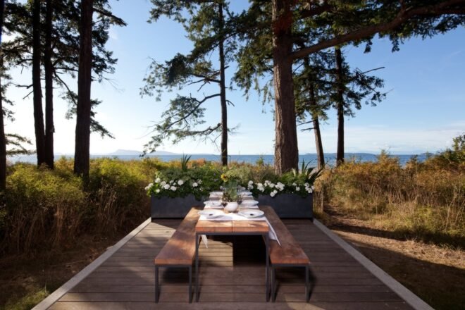 a large dining table on an open-air deck