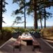 a large dining table on an open-air deck