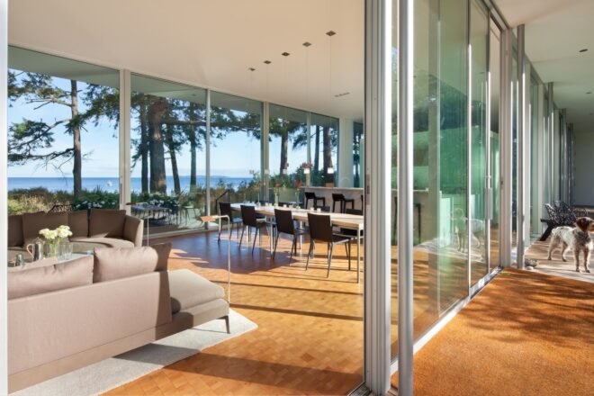 a living space that opens up to the outdoors via sliding glass doors