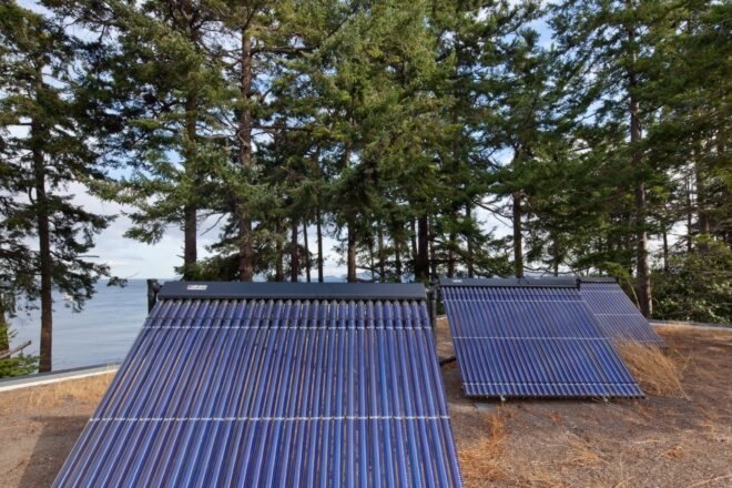 solar water heating panels on grassy roof
